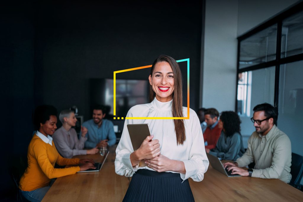smiling businesswoman with her colleagues meeting in board room